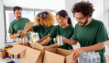 volunteer packing food donation boxes 