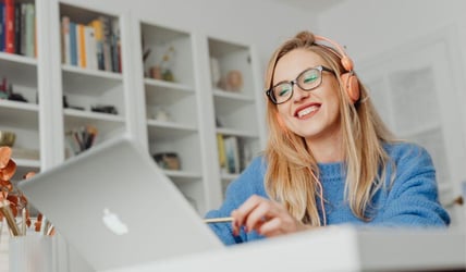 Women on laptop practicing Cyber Security 