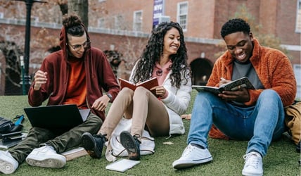 Students on campus studying 